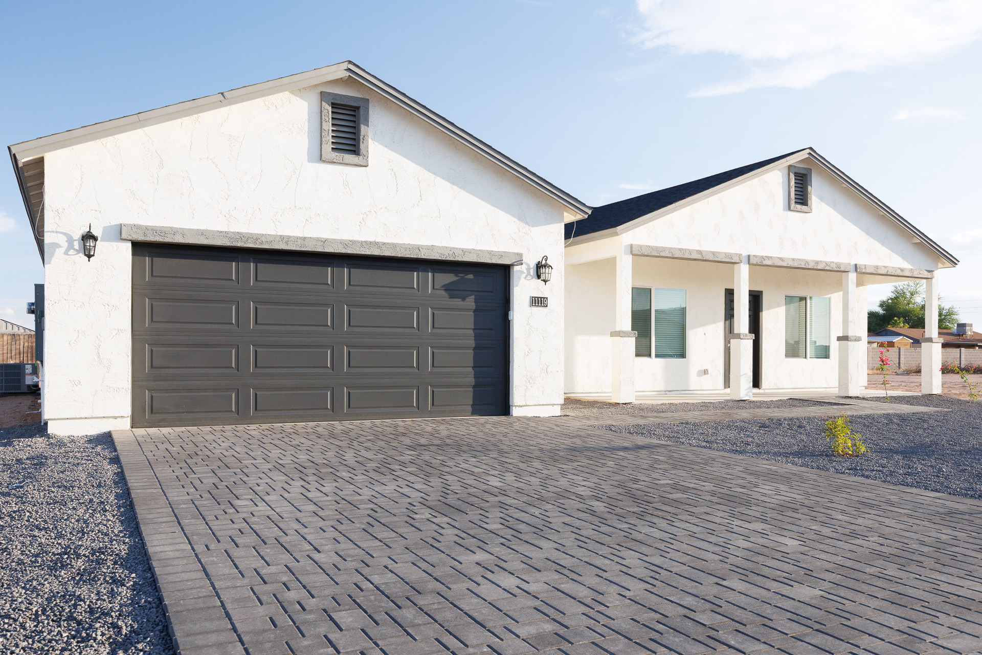 Full exterior of the Azcension home at 11119 W Hobbit Drive, viewed from the front left