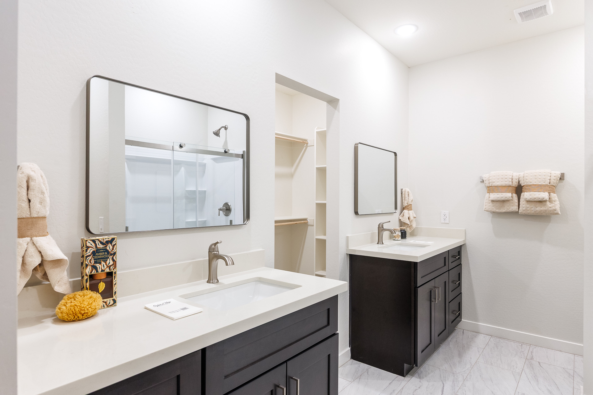 Primary bathroom with two vanities at 11119 W Hobbit Drive